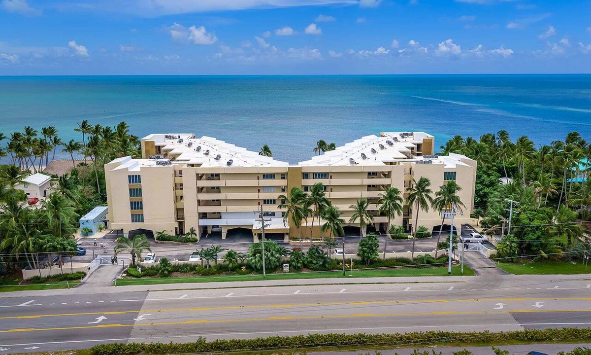 Islamorada Condo | 2BR Islamorada condo with pool, gym, balcony, and full kitchen.