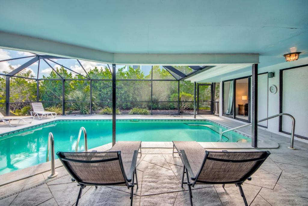 Laguna Shores House | 8305 Estero Boulevard - Large beach home with screened-in lanai area & pool!