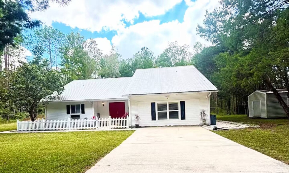 St. Augustine House | Beautiful 3 bedroom building with swimming pool surrounded by wooded area .