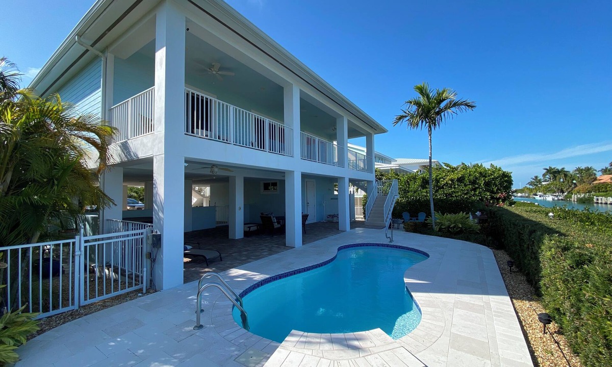 Coury House | Charming 3-bedroom house with pool and boat dock in Key Colony Beach
