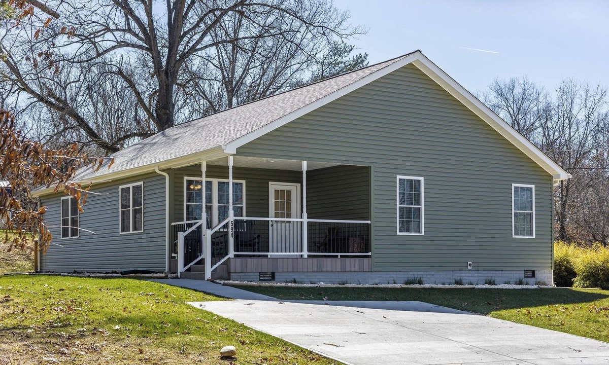 Radford House | Cozy home with a modern kitchen, spacious living, serene bedrooms, and a private deck for relaxation