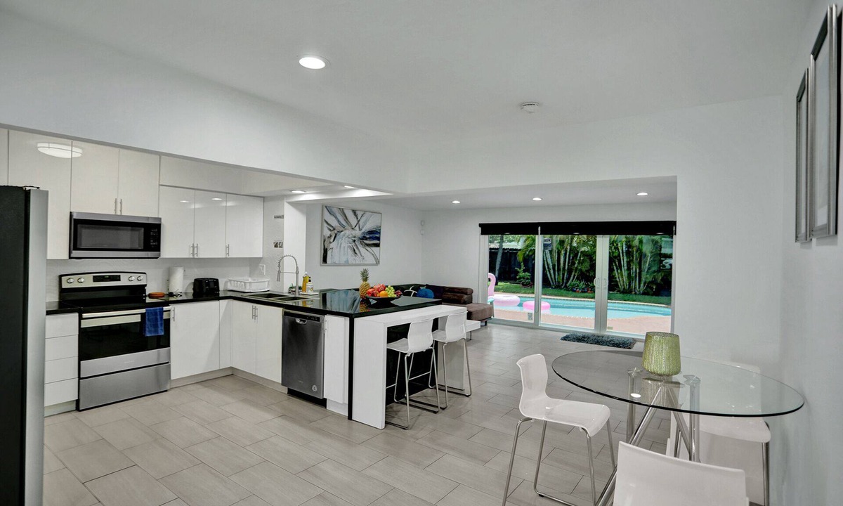 Royal Poinciana House | Elegant House with Pool & Tropical Backyard