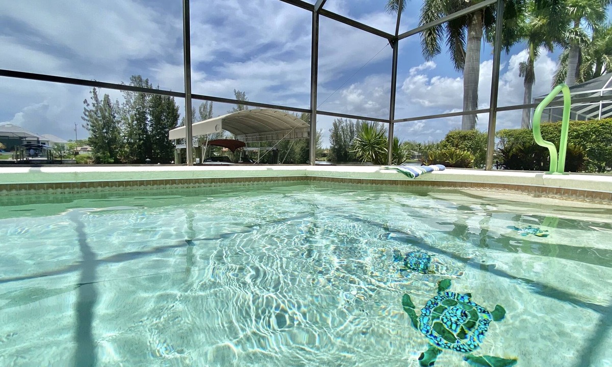 Burnt Store House | Relax! Canal Home, Sunsets, Heated Pool, Lanai with TV, Boat Dock, Gulf Access