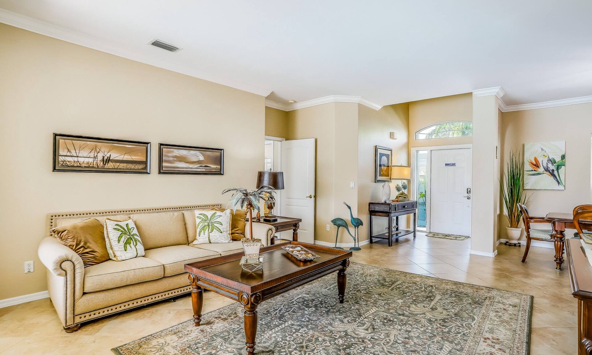 Biggar House | Spacious home with screened-in pool & lush lakefront views - minutes to beaches