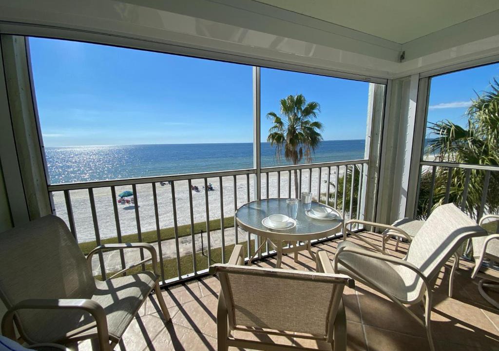 Mid Island House | Strandview #304 - Beachfront condo with screened-in patio and amazing view!