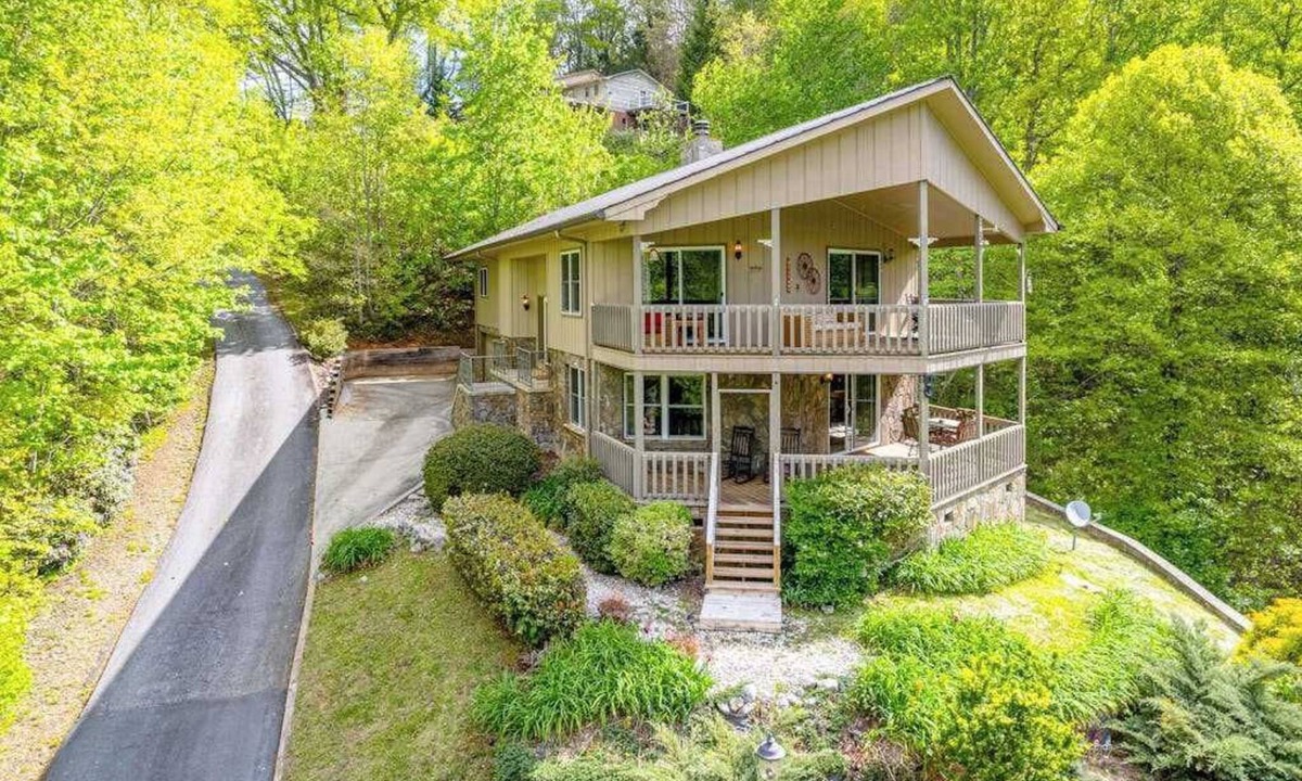 Franklin House | View-worthy home lined by trees with a fireplace, wrap-around deck, grill, & W/D