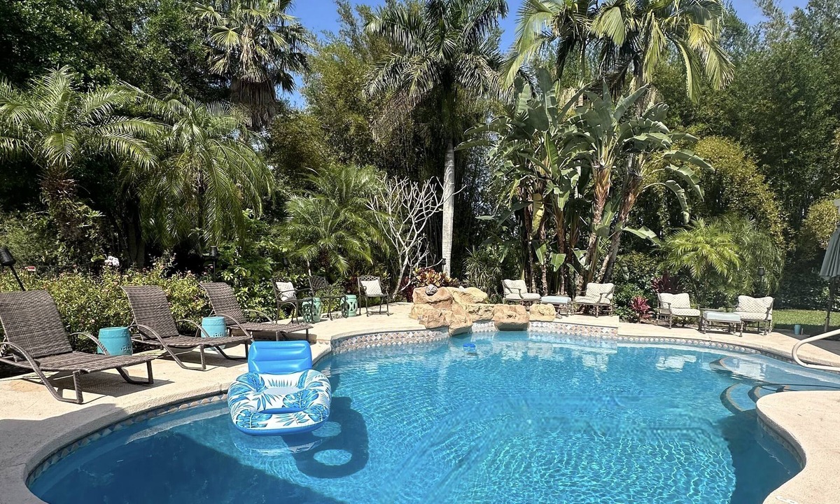 Wellington House | Waterfront Resort Style Oasis ~ 2 Acres, Heated SW Pool, Fire Pit, Outdoor Games
