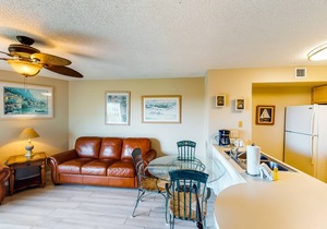 Coastal retreat with private balcony, pool, & easy beach access