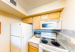 Coastal retreat with private balcony, pool, & easy beach access