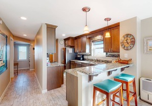 Condo with sweeping panoramic views of the Gulf, two beach chairs & umbrella