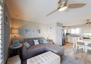 Cozy coastal condo close to beach access with shared pool, WiFi, & central AC