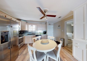 Cozy coastal condo close to beach access with shared pool, WiFi, & central AC