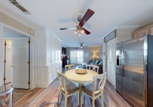 Cozy coastal condo close to beach access with shared pool, WiFi, & central AC