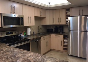 End unit with extra windows. Steps to the beach, private beach access!