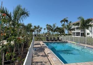 End unit with extra windows. Steps to the beach, private beach access!