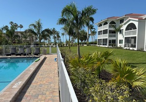 End unit with extra windows. Steps to the beach, private beach access!
