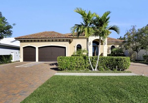 Picturesque waterfront home w/ heated pool, hot tub & outdoor kitchen
