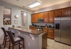 Spacious Condo w/Private Covered Balcony, Gourmet Kitchen, & Free WiFi