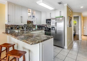 Stylish first-floor condo with water views & easy beach access