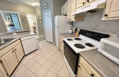 West Kissimmee Condo | 19-202 Gated Resort, Private balcony, heated pool, minutes from Disney! gym
