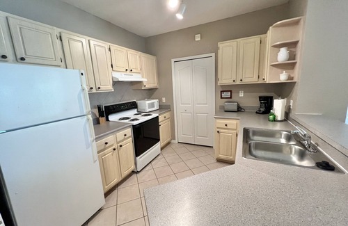 West Kissimmee Condo | 19-202 Gated Resort, Private balcony, heated pool, minutes from Disney! gym