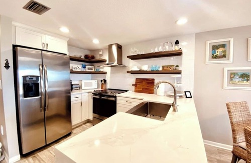 Butler Beach Condo | Direct Beachfront Location! Updated, Well Appointed Open Concept Design! Pool!