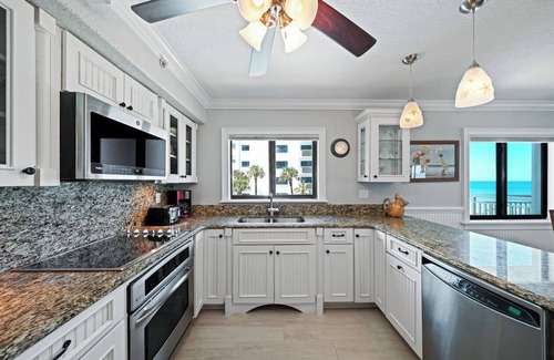 New Smyrna Beach Condo | Direct oceanfront corner condo with a large wrap around balcony and heated pool