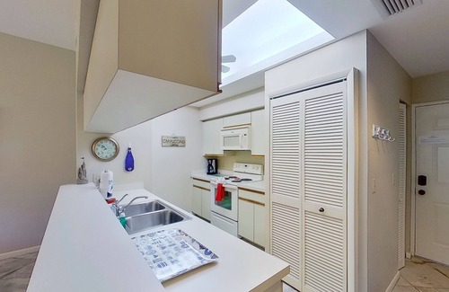 Bonita Bay Condo | Gated resort community condo with water views, pool, hot tub, & balcony
