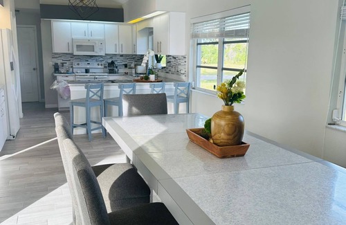 Rotonda Lakes House | Modern luxury Beach house w/free heated pool seating in half acre lot and canal