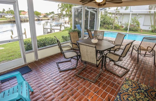 Mid Island House | Peaceful, spacious canal-front home w. private screened-in pool
