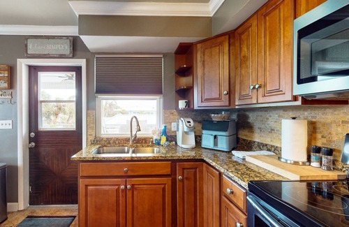 Mid Island House | Spacious home with heated pool, lots of outdoor entertainment, and WIFI