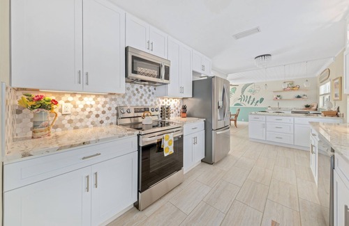 Convair Cove House | Waterfront Home with Dock | Heated Pool & Spa | 4.5 Blocks to Beach & Downtown