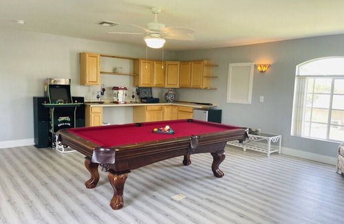 Cape Coral Villa | 4-bedroom, pool, fishing, games, BBQ, kayak and front water.
