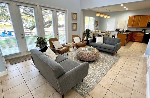 Cocoa Beach House | 4BR Private Canal Home Near Beach: Hot Tub, Tiki Bar, Fire Pit, Dock & Game Room