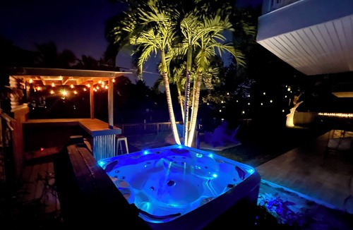 Cocoa Beach House | 4BR Private Canal Home Near Beach: Hot Tub, Tiki Bar, Fire Pit, Dock & Game Room