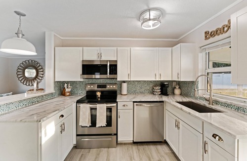 Jensen Beach House | 8 Minutes from numerous beaches, hot tub and beautiful fire pit