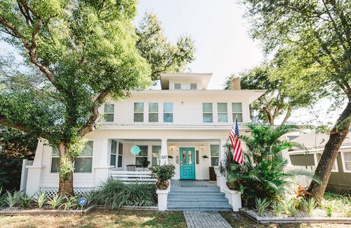 Historic Uptown House | An Art-Filled Garden Apartment Near Parks and Downtown