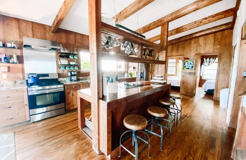 Alligator Point House | BEACH FRONT to BAY with boatdock, swimming pool, pickleball courts and kayaks.