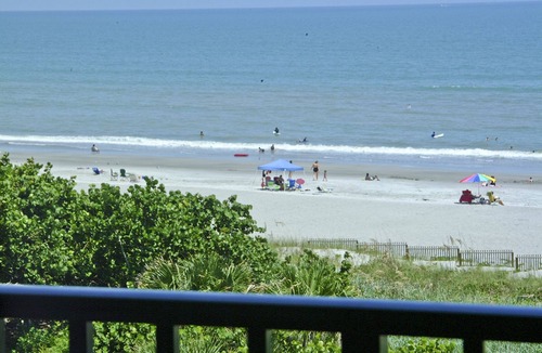 Port Canaveral Condo | BEACH FRONT TOP FLOOR w/Private Balcony - Master Bedroom & Living Room on Ocean