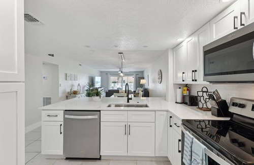 Cocoa Beach Condo | Beachside Ground-Floor Condo– Steps to the Beach W/Heated Pool & Private Patio