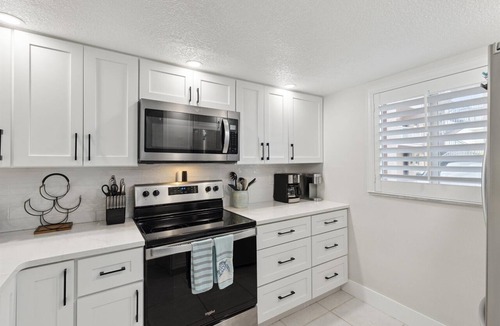 Cocoa Beach Condo | Beachside Ground-Floor Condo– Steps to the Beach W/Heated Pool & Private Patio