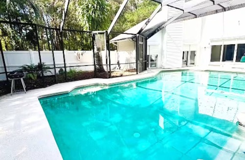St. Augustine House | Beautiful 3 bedroom building with swimming pool surrounded by wooded area .