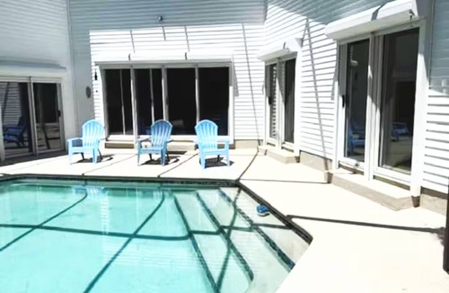 St. Augustine House | Beautiful 3 bedroom building with swimming pool surrounded by wooded area .