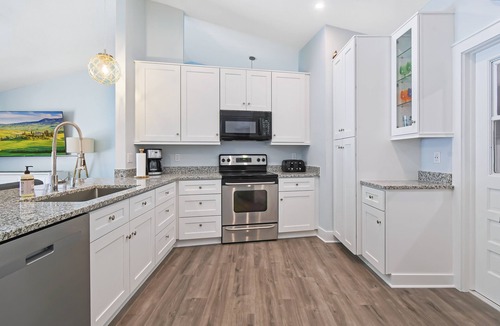 Palm Harbor House | Beautiful Ibis Cottage for outdoor lovers with pool, fire pit, and billiard room