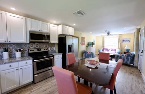 Flamingo Bay House | Charming 3-bedroom upstairs unit in a house with a shared pool in pine island