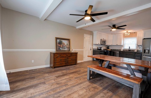 Crouse House | Charming house in a golf course community with lake views and a big yard.