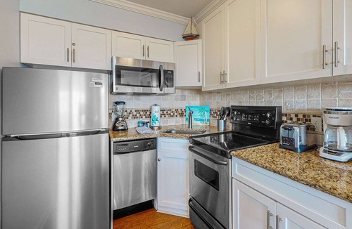 North Forest Beach Condo | Charming Waterfront Villa with Ocean Views, Private Balcony & Pool, Steps to the Beach