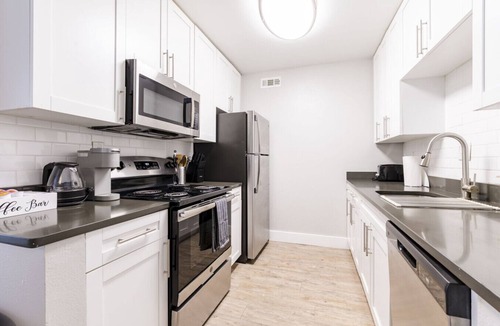 Beach Park Apartment | Contemporary 2BR Stay | Pool, Gym & Grill Area