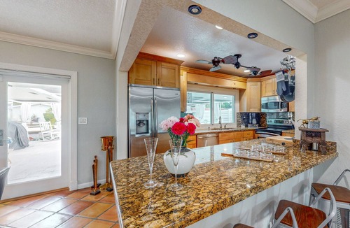 Nautilus Isle House | Cozy Home with pool, dock, canal view, fully equipped kitchen, dog friendly