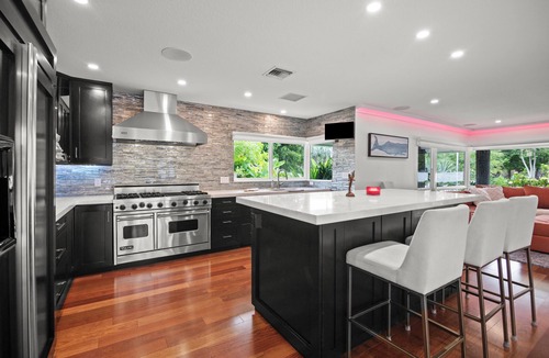 Harbour Inlet House | Custom remodeled home with tropical setting in exclusive Harbor Inlet community